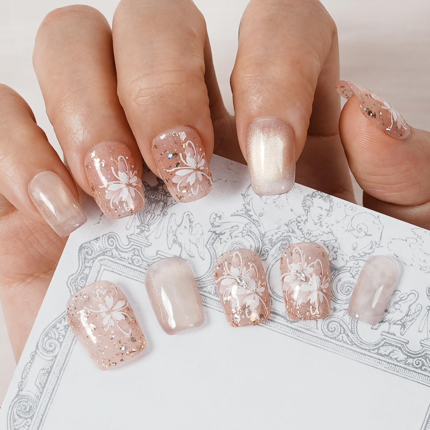 Tesytto Handmade Press on Nails Glitter Short Coffin, Nude Pink with Flower & Butterfly Pattern, Reusable Full Cover False Nails 10Pcs (Warm Glossy Dream,S)
