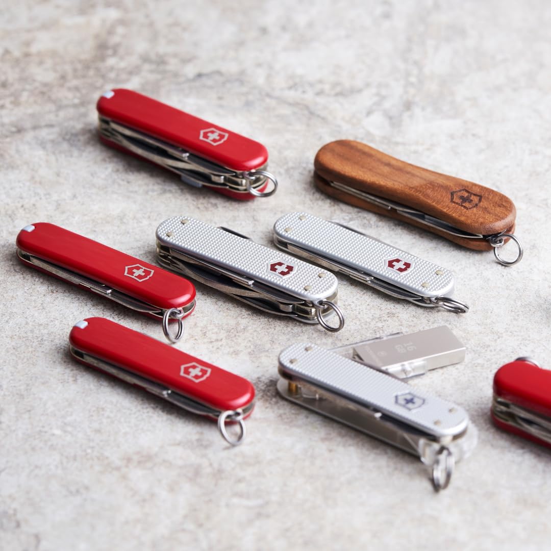 Victorinox Rally Swiss Army Knife, Compact, 9 Functions, Swiss Made Pocket Knife with Magnetic Phillips Screwdriver, Bottle Opener and Key Ring - Red