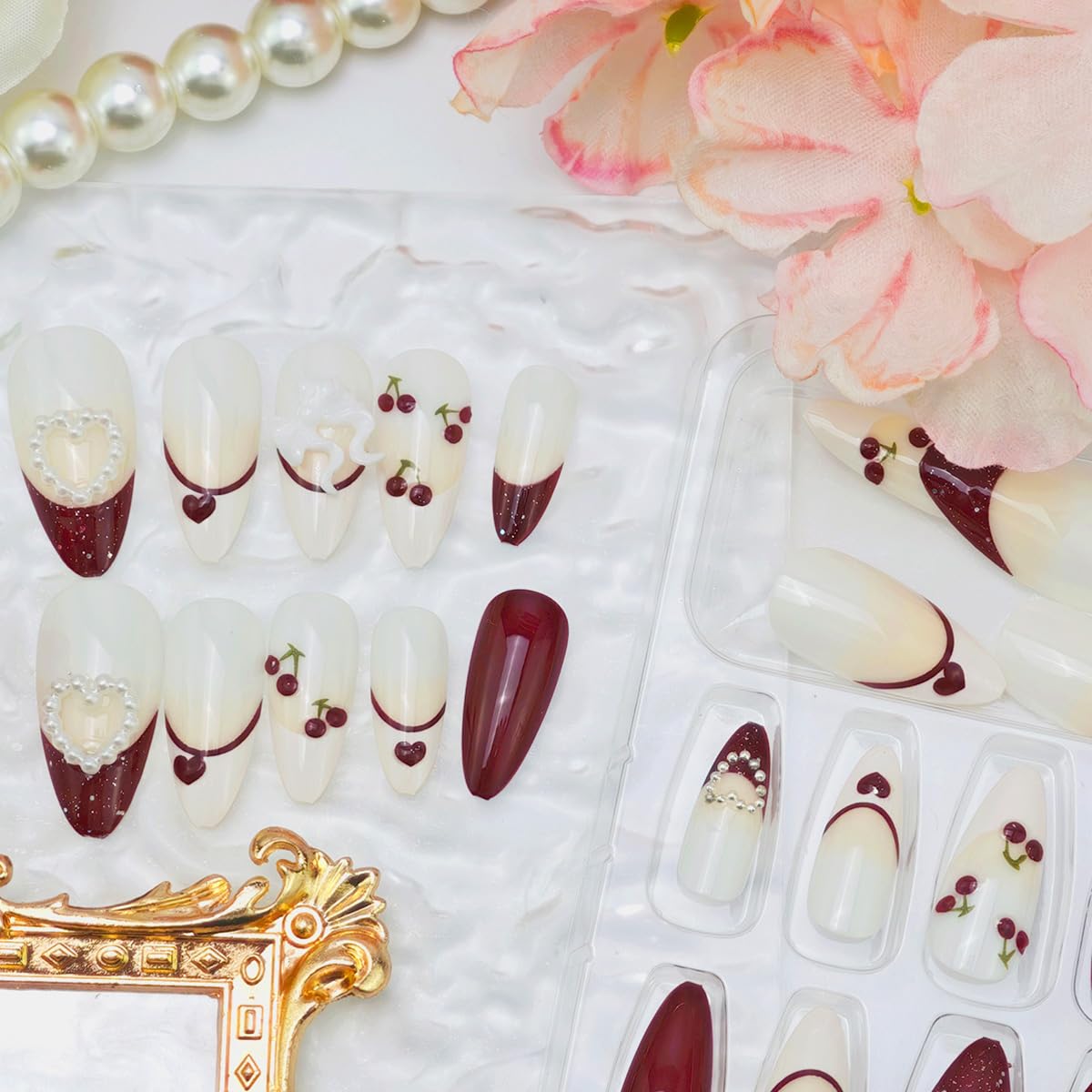 24Pcs Valentines Press on Nails Medium Almond Fake Nails with White Bow Cherry Heart Designs Artificial Acrylic Glue on Nails Red French Tip False Nails 3D Pearl Full Cover Stick on Nail for Women