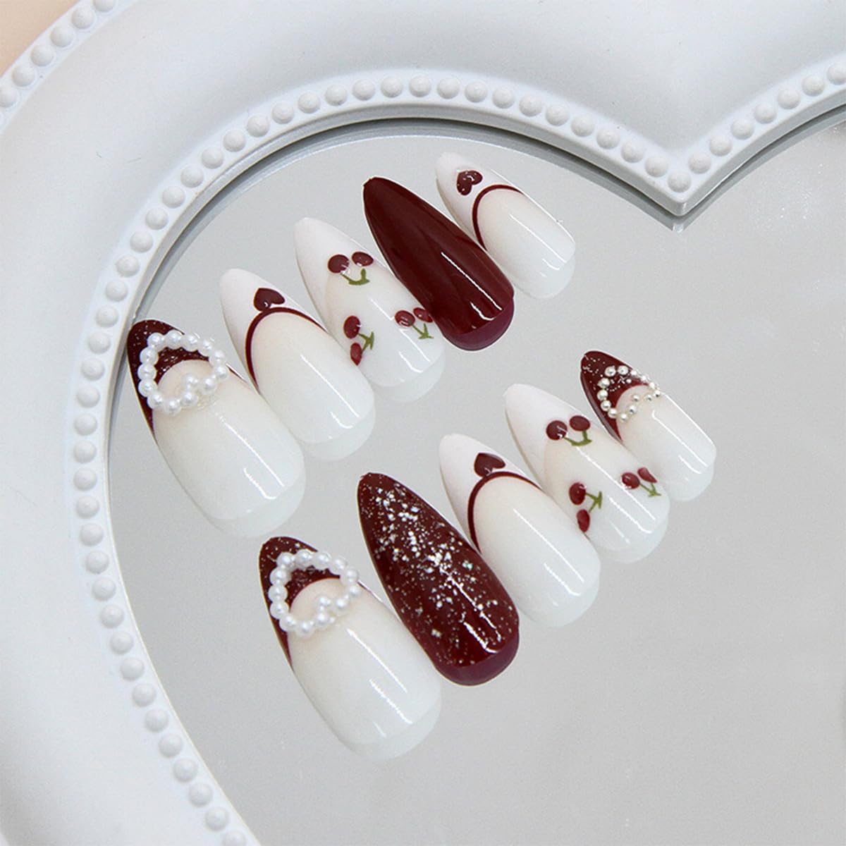 24Pcs Valentines Press on Nails Medium Almond Fake Nails with White Bow Cherry Heart Designs Artificial Acrylic Glue on Nails Red French Tip False Nails 3D Pearl Full Cover Stick on Nail for Women