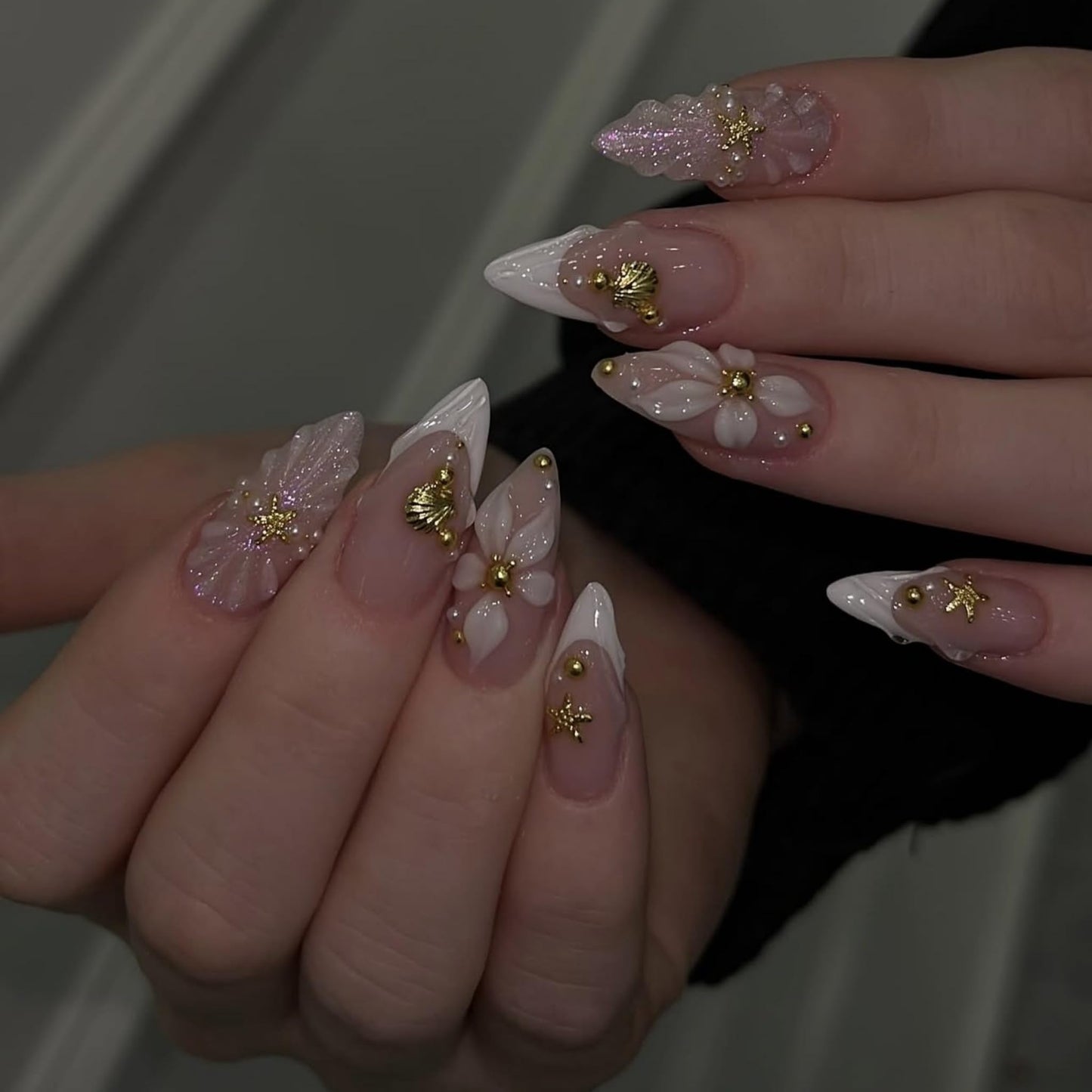 Almond Press on Nails Long Fake Nails Nude Acrylic Nail Press ons SEENEEY French White Floral and Gold Charm Designs Cute Stick on Nail for Women 24pcs
