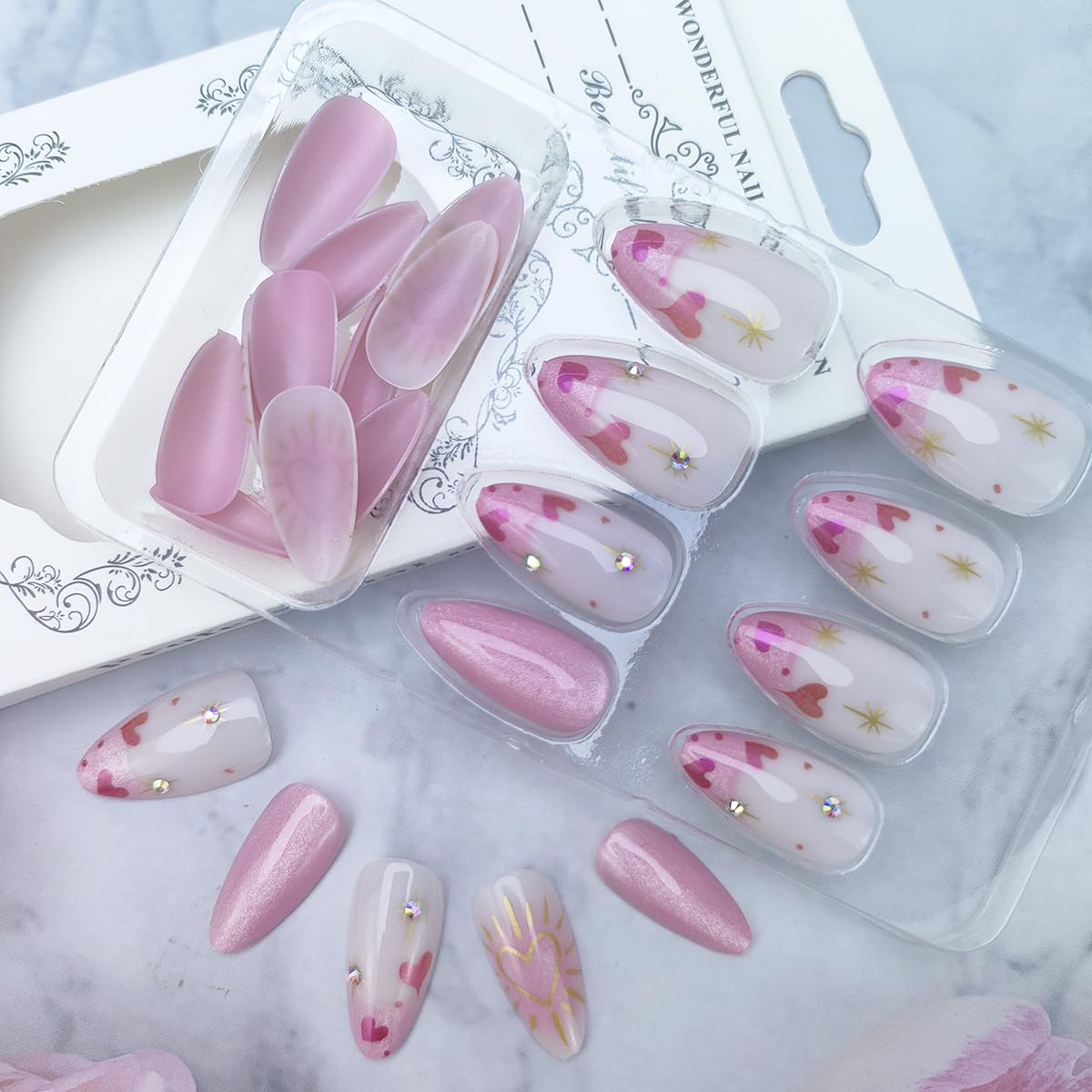 24Pcs French Press on Nails Almond Medium Length Fake Nails with Gold Heart Star Rhinestones Design Acrylic Glue on Nails Full Cover Stick on Nails Glitter Pink Artificial Nails for Women Nail Decor