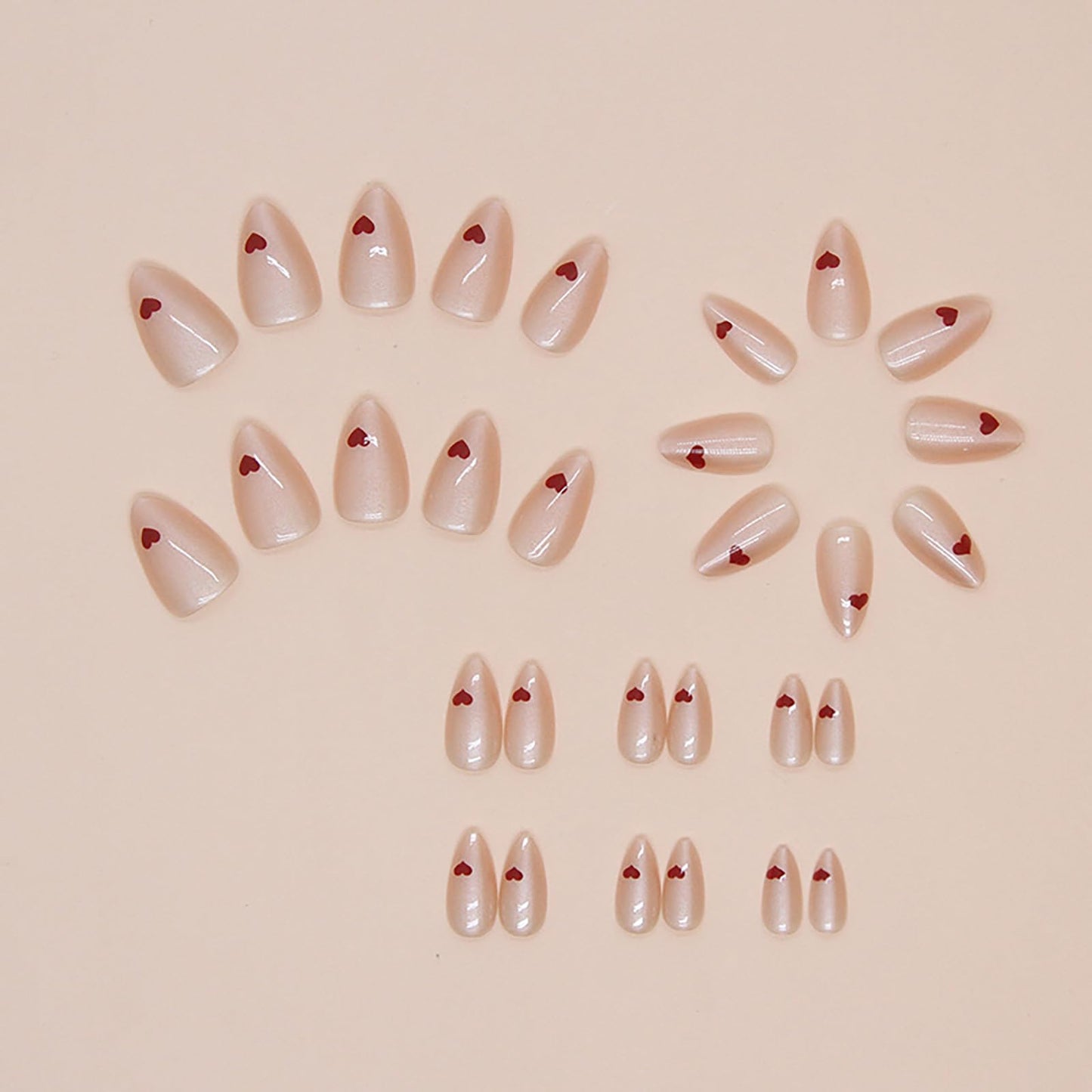 Short Almond Press on Nails Nude Pink Fake Nails With Designs Heart Motif Nails Press ons Acrylic Nails False Glossy Artificial Full Cover Stick on Nails for Women Girls 24 Pcs