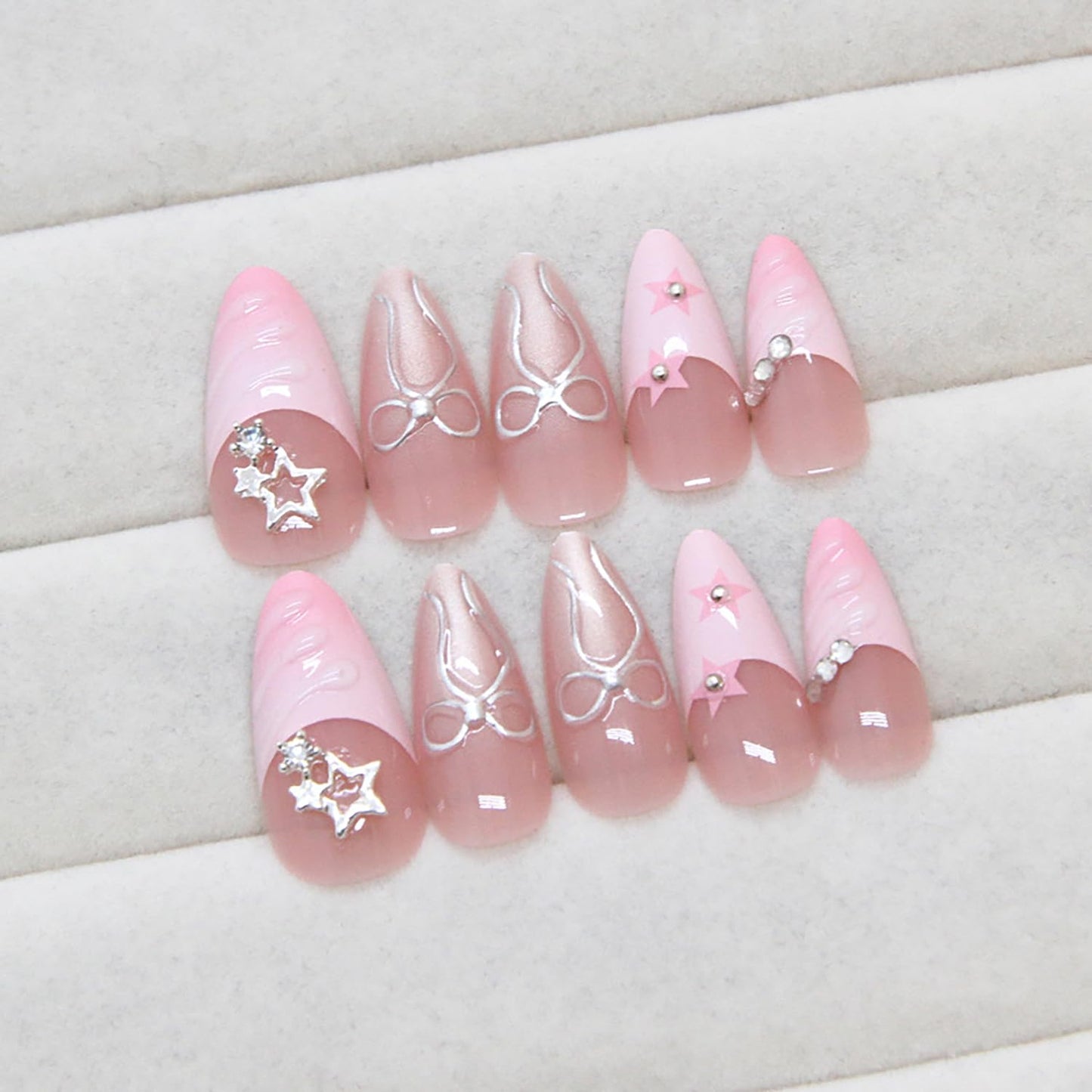 RIICFDD 24 Pcs Medium Almond Press on Nails Pink Fake Nails Star Nails Press ons 3D Water Ripple Glue on Nails Bow Rhinestone Nail Charms Full Cover Glossy Acrylic Nails for Women French Nails