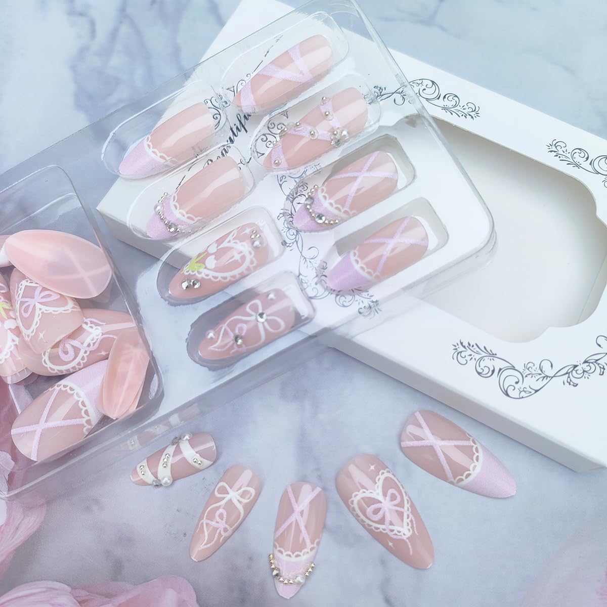 24Pcs Pink French Tip Press on Nails Medium Almond Fake Nails with Heart Pearl Bow Designs Nude False Nails Glossy Full Cover Acrylic Nails Cute Stick on Nails for Women Girls DIY Manicure Decorations