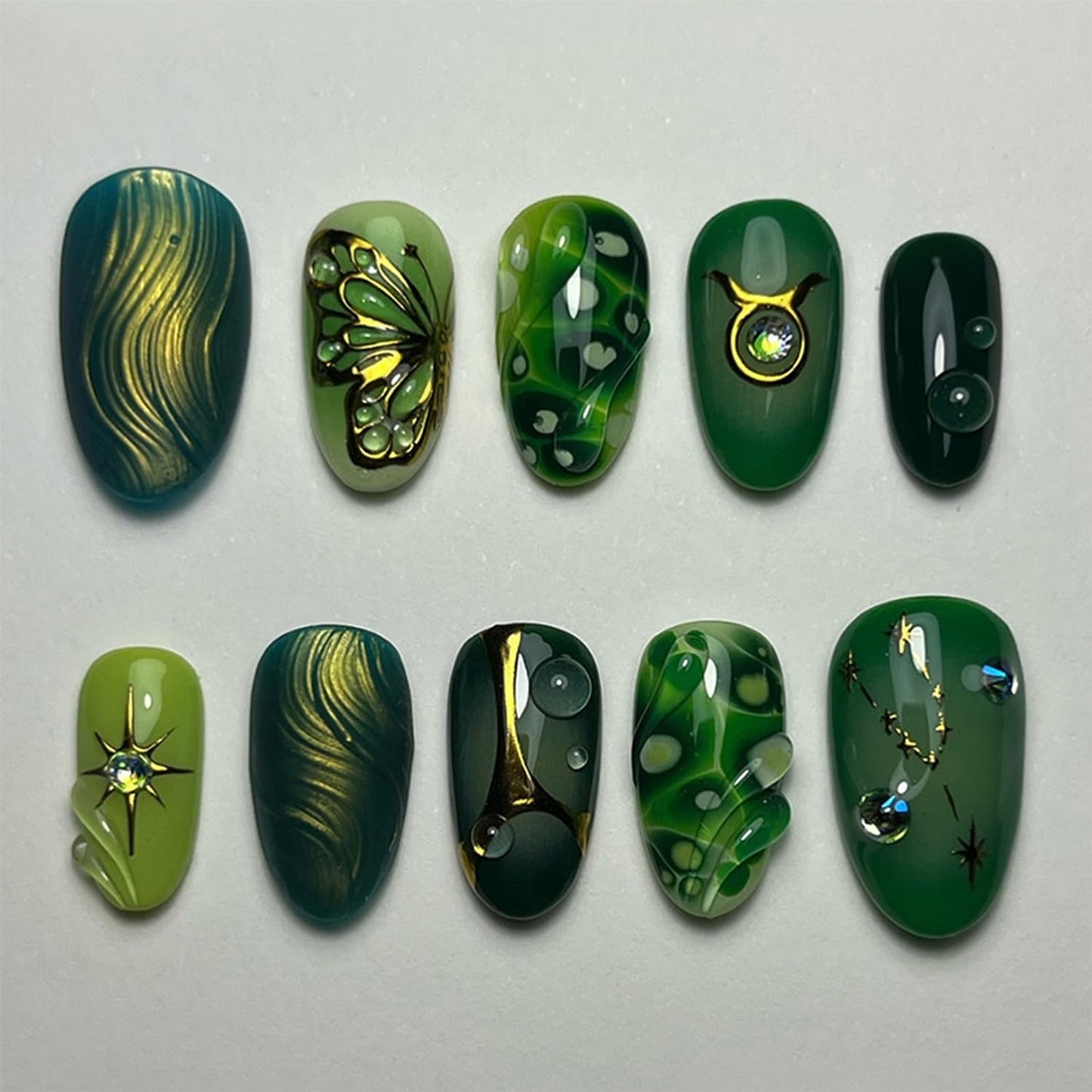 30Pcs Green Press On Nails Medium Almond Fake Nails with Gold Butterfly Star Rhinestone Design Marble Green Stick on Nails Handmade Full Cover Acrylic Nails for Women Daily Wear Manicure