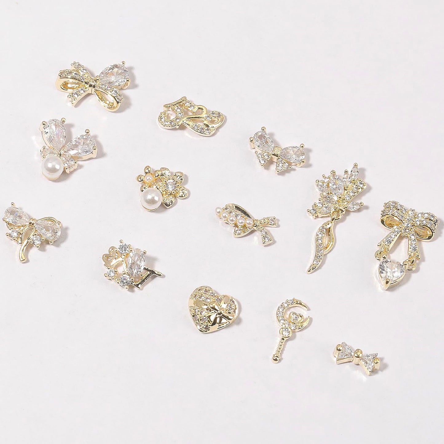 HNUIX Nail Charms and Gems - Gold Copper Zircon, Multiple Shapes 3D Dangle, Metal Luxury Jewelry Rhinestones for Nails 14 Pieces