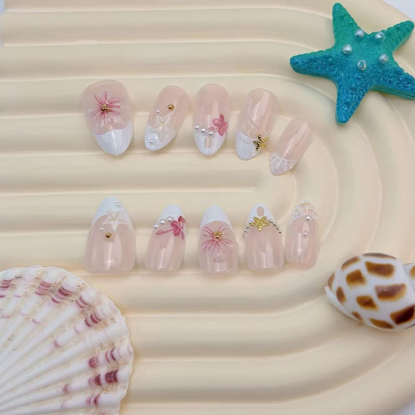 30Pcs Short Almond Press On Nails, Summer Beach Theme False Nails with 3D Pink Flowers, Starfish, Shell, Gold Stars & Pearls, Nude Pink French Tip Acrylic Nail Set for Women DIY Manicure