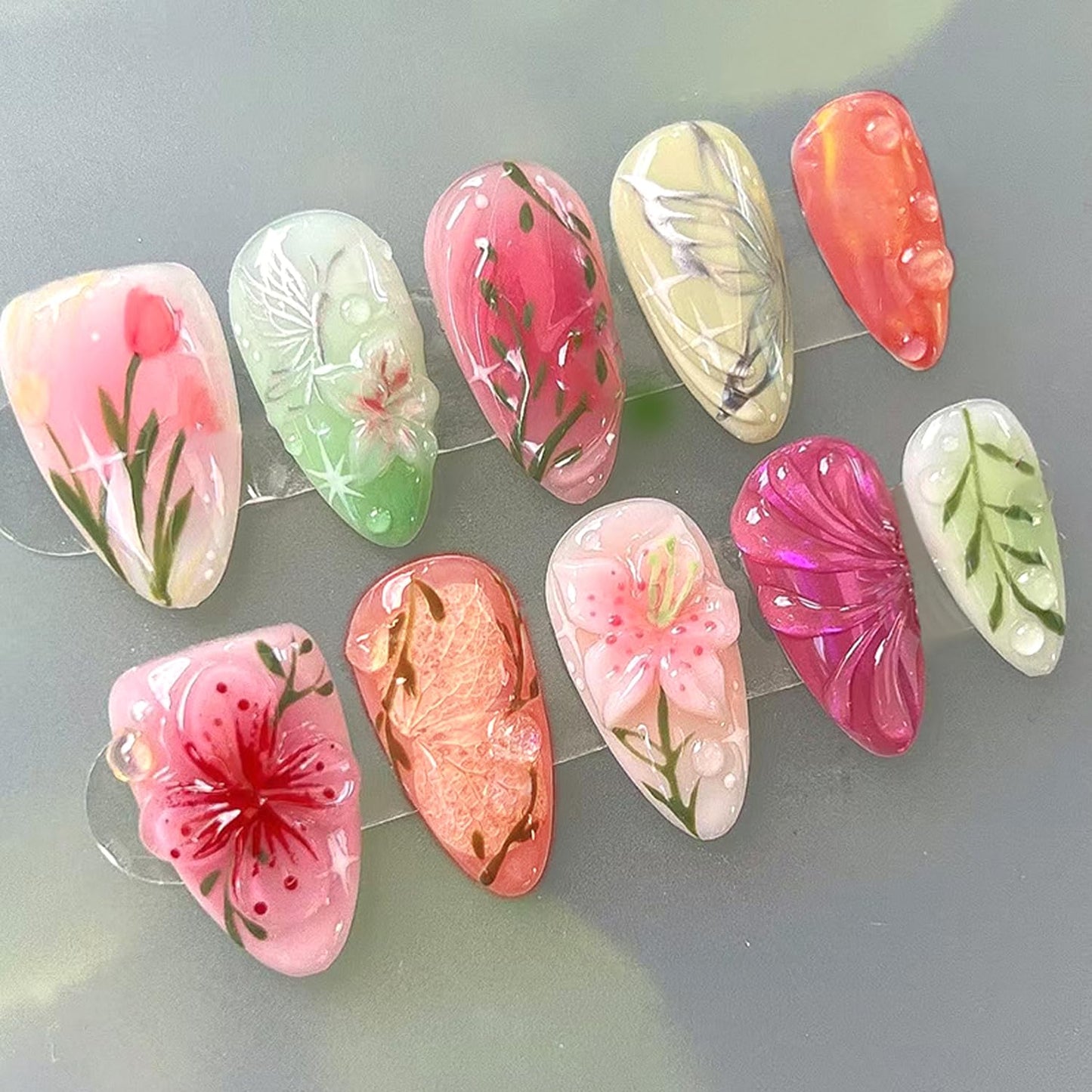 24Pcs Spring Colorful Flower Press on Nails Medium Almond Fake Nails Floral Butterfly Glossy Design Pink Full Cover Stick on Nails Flowers Nail Art Acrylic False Nails Set for Women DIY Manicure