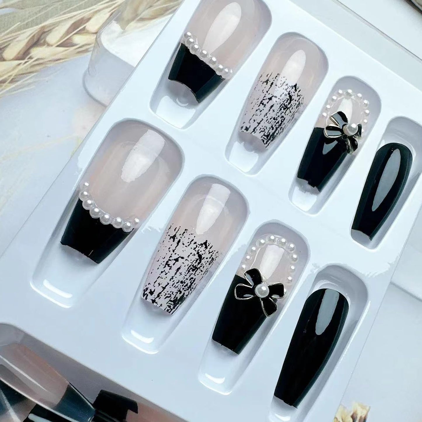 YKZFUI 24Pcs Press on Nails Medium Length Fake Nails with Black Bow Pearl Designs,Artificial Acrylic Full Cover Reusable Coffin False Nails, Women Glue on Nails Set,Stick on Nails for Nail Art