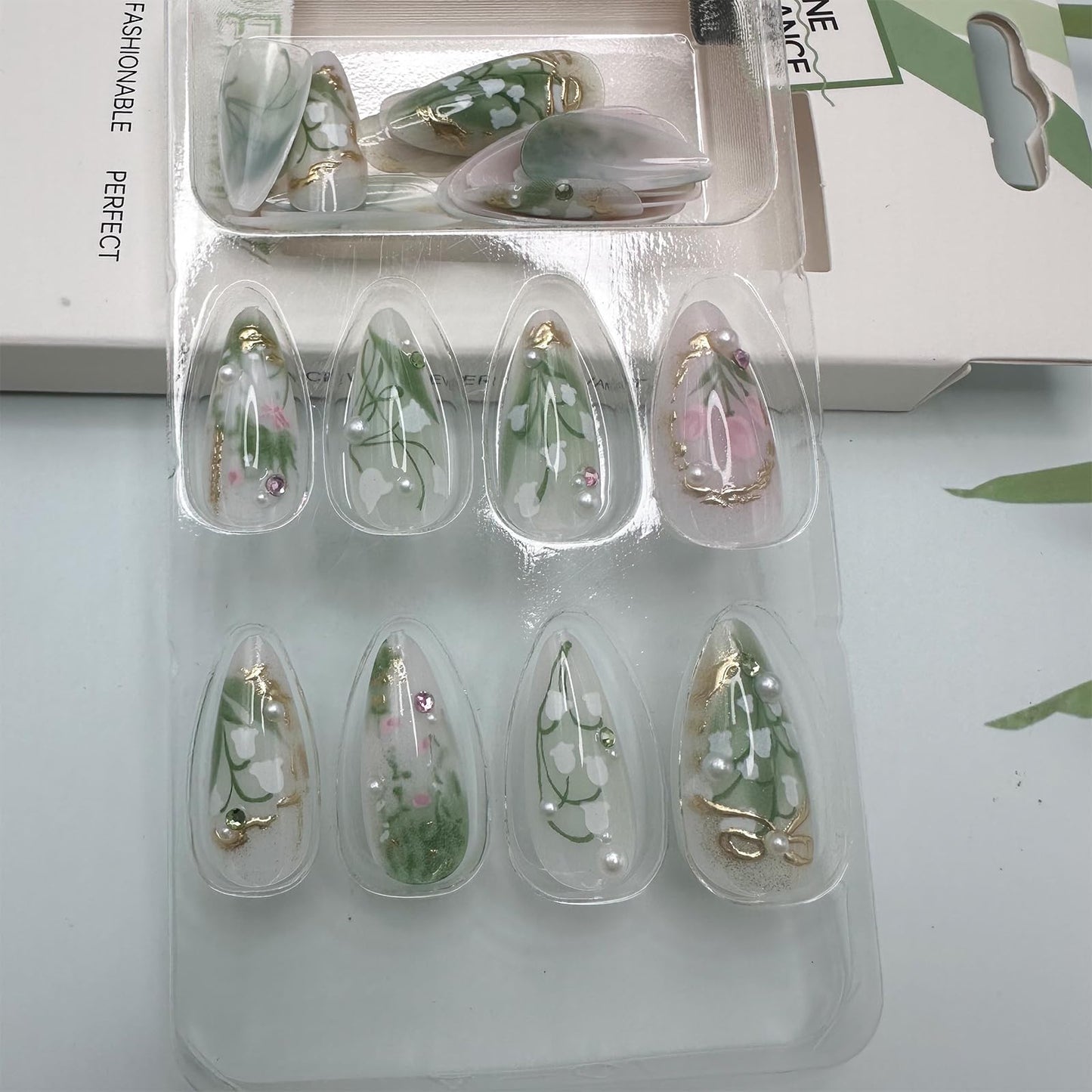 LBPEPAMZ Green Press on Nails Medium Almond Fake Nails with 3D Pearl Rhinestones Designs Gold French Tips Flower Acrylic Nails False Nails White Floral Full Cover Glossy Stick on Nails for Women 24Pcs