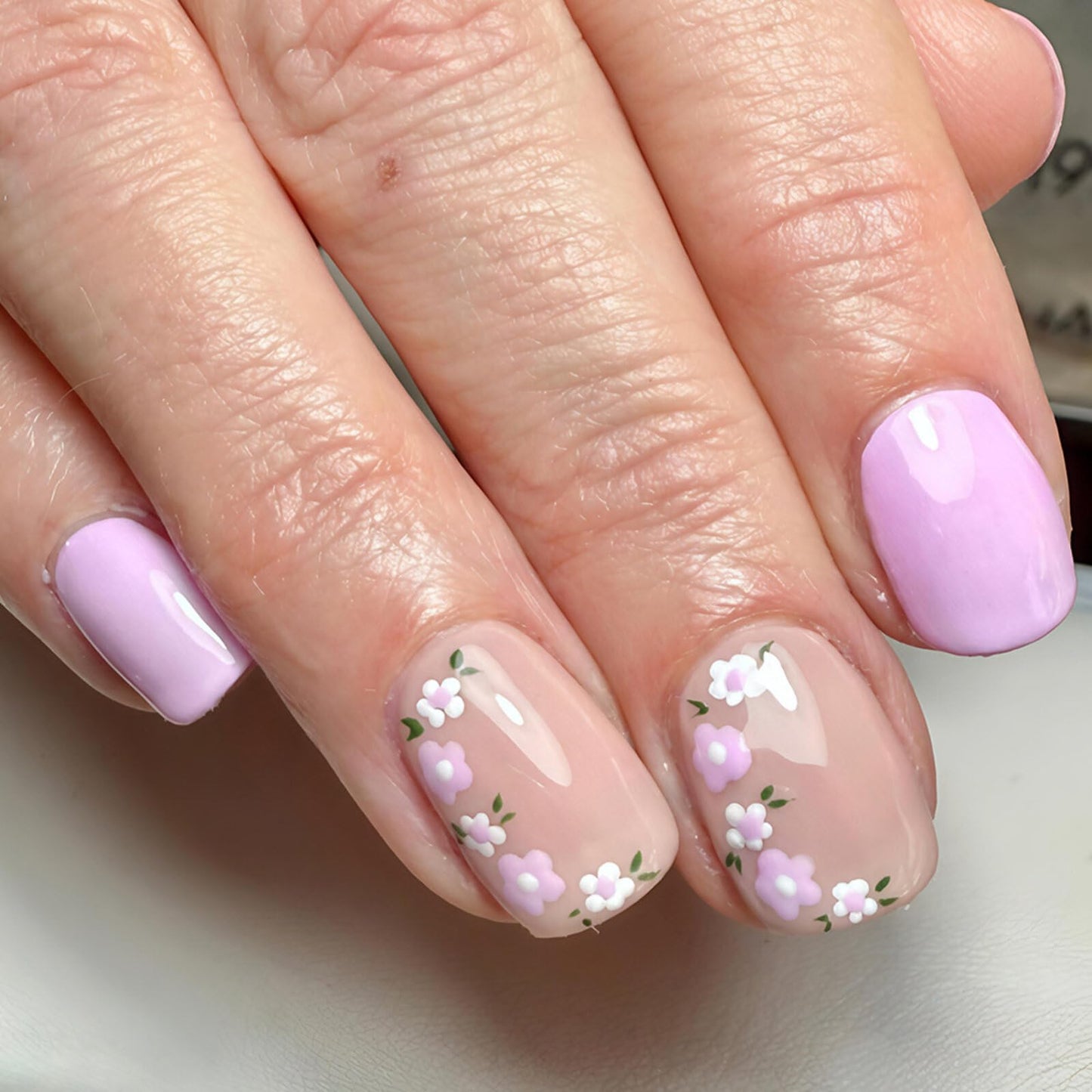 Floral Short Square Press on Nails Soft Nude Lavender Base Purple White Floral Accents Glossy Finish Reusable Spring Nails Easy Apply Fashion Party Wear Durable Trendy Women Girls Nail Art 24 Pcs