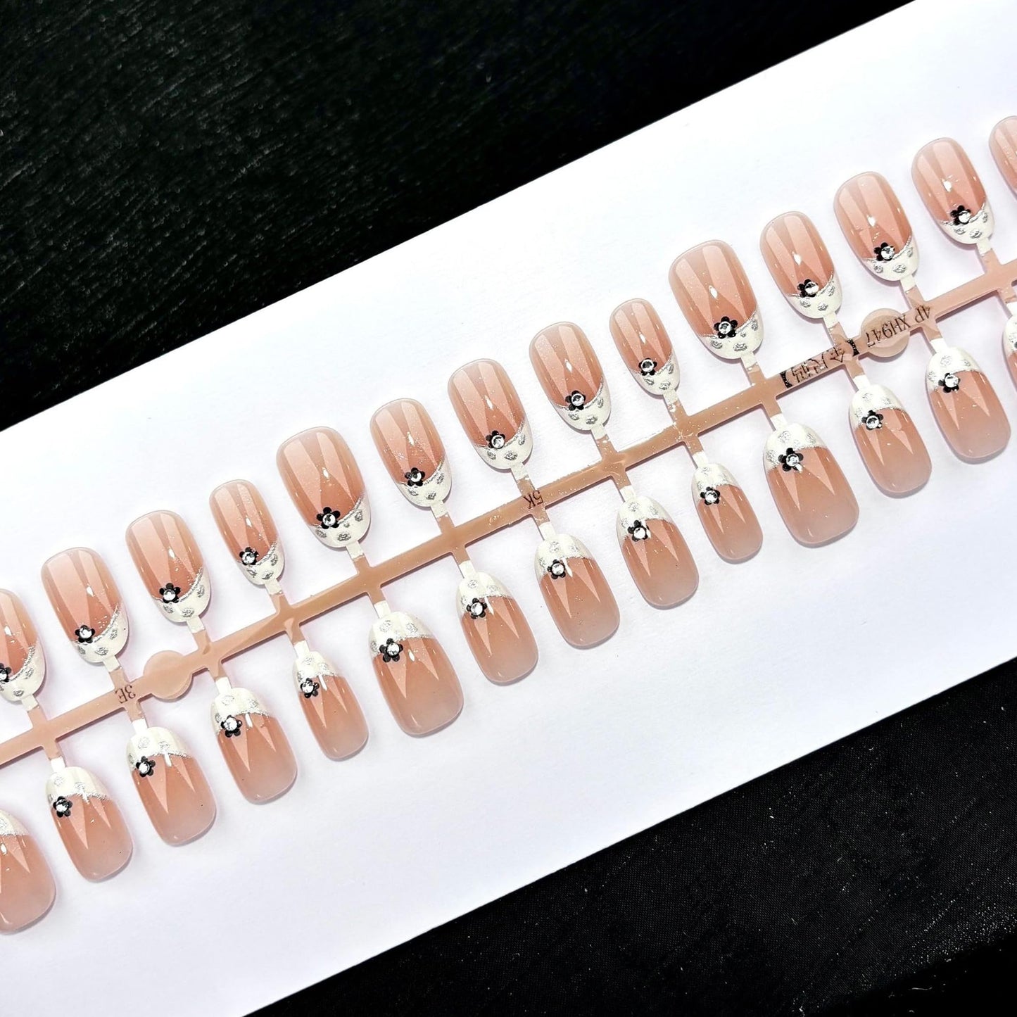 24Pcs French Tip Press On Nails Short Almond Fake Nails Nude Pink with Black Flowers & Silver Rhinestones Glossy Acrylic False Nails with Glitter Edge,Full Cover Stick On Nails for Women DIY Manicure