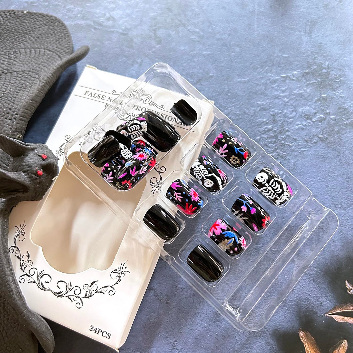 CJDLTS Black Halloween Press on Nails Short Square White Skull False Nail Acrylic Artificial Fingernails Colorful Flowers Design Full Cover Glossy Festival Stick on Nails for Women Supplies 24Pcs