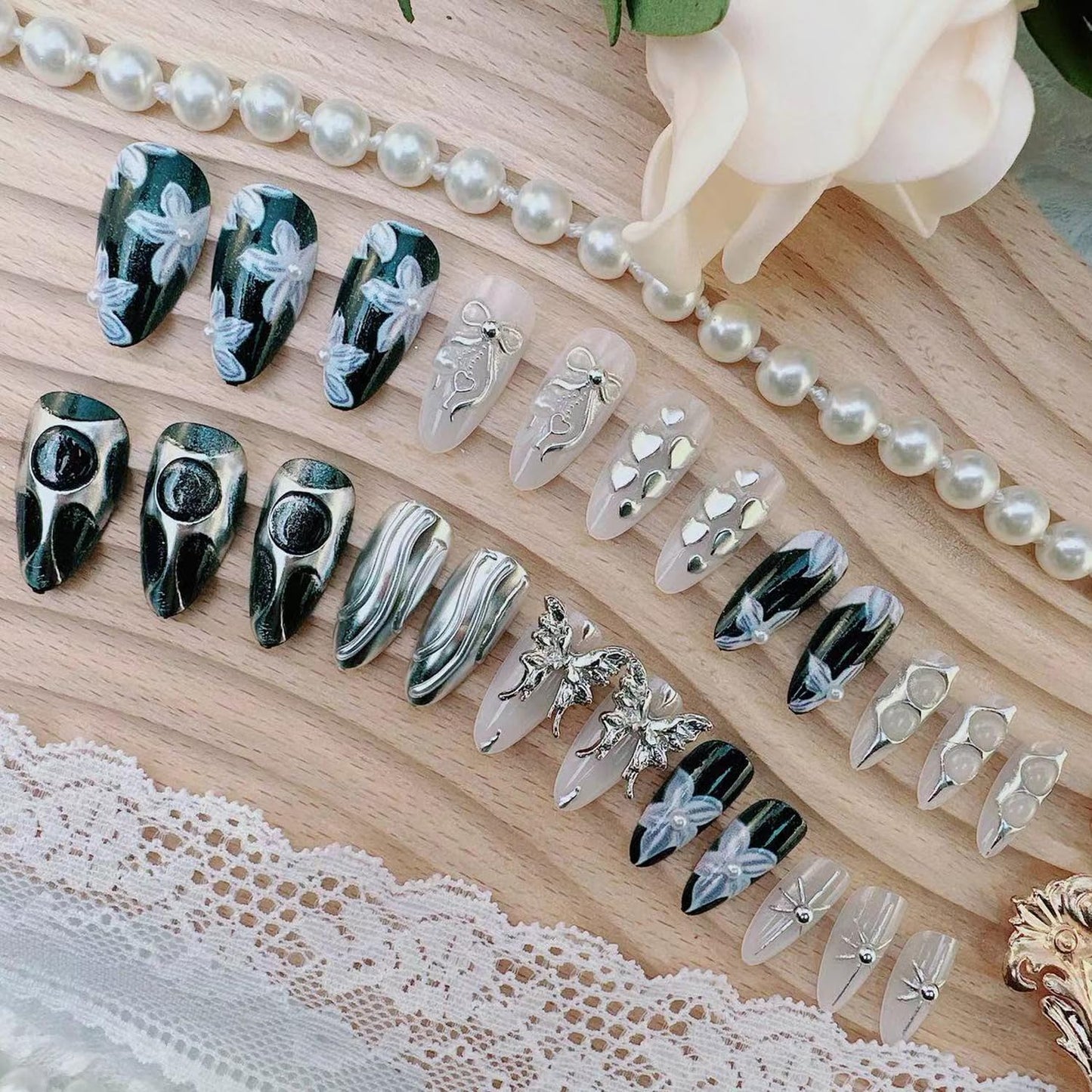 24Pcs Handmade Y2K Press on Nails Almond Fake Nail with 3D Butterfly & Silver Bow Heart Star Irregular Pattern Flower Pearl False Nail Gothic Punk Black Nail Tip French Tip Stick on Nail for Women