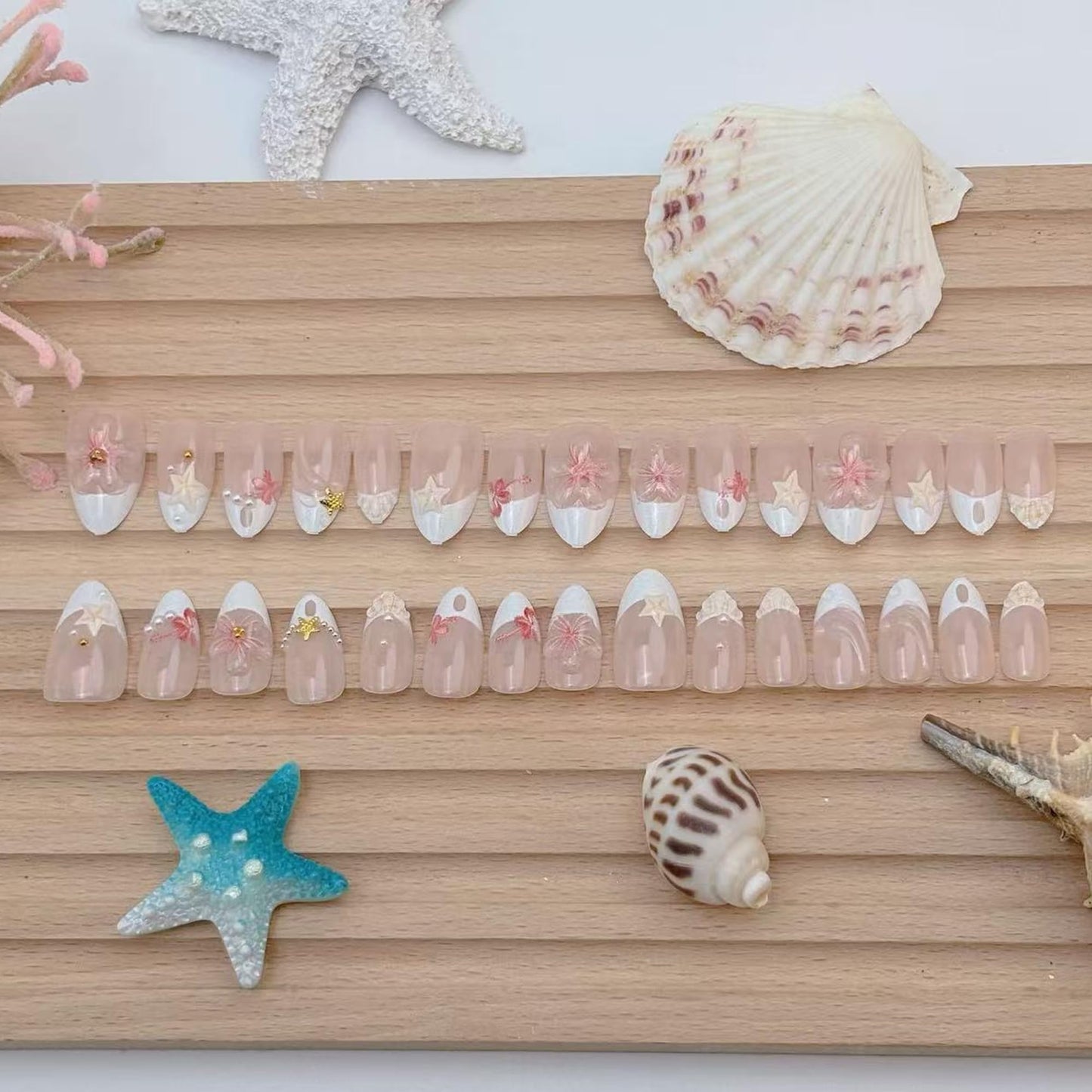 30Pcs Short Almond Press On Nails, Summer Beach Theme False Nails with 3D Pink Flowers, Starfish, Shell, Gold Stars & Pearls, Nude Pink French Tip Acrylic Nail Set for Women DIY Manicure
